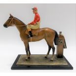 Vintage cold painted metal table lighter in the form of a horse and jockey, height 17cm.