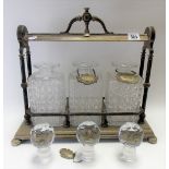 Victorian silver plate three-section Tantalus with cut glass decanters & stoppers, width 42cm (lacks