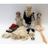 Four early 20th Century porcelain head composition dolls; together with a painted Papier Mache