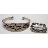 Silver Niello strapwork bangle; together with a continental 830 silver foliate cast brooch (2)