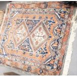 Four small Eastern wool hand-knotted rugs