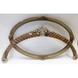 Walnut carved and silver painted furniture mount, width 102cm; together with an oval gilt gesso