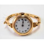 1920's/30's ladies 9ct gold manual wind wristwatch with circular white enamel dial & 9ct gold