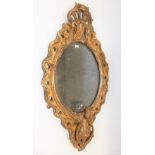 19th Century gilt wood & gesso oval girandole wall mirror, the frame foliate scroll moulded & with