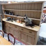 Large Victorian pine kitchen dresser, the superstructure with moulded cornice over two shelves,