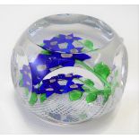 A St. Louis glass paperweight 'Blue Flowers in Latticino', clear encased, monogram & dated 1977,