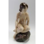 Royal Copenhagen porcelain group depicting a young girl on a rock modelled by Adda Bonfils,