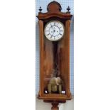 Walnut case Vienna two-train wall clock, the 7 inch white enamel dial with Roman numerals &