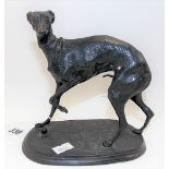 Bronze model of a whippet after Mené, upon an oval incised base, signed, height 15cm.