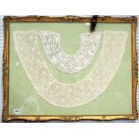 Two framed lace collars.