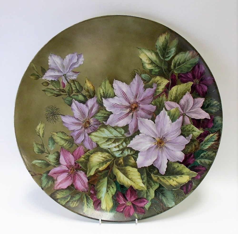 Early 20th Century painted porcelain charger, foliate decorated, the back signed S. Lee, diameter