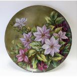 Early 20th Century painted porcelain charger, foliate decorated, the back signed S. Lee, diameter