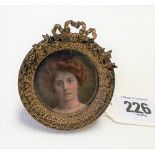 Victorian lacquered bronze circular easel miniature picture frame cast with a ribbon & foliate