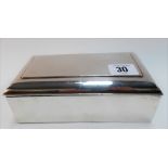 George V silver hinge lidded cigarette box of plain form, maker HM, Birmingham 1924, width 17cm.