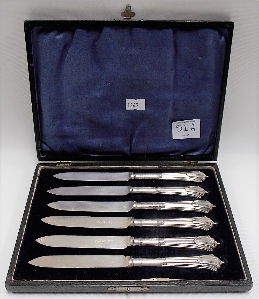 Cased set of six silver weighted handle fruit knives, Sheffield 1919.