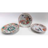 Three 18th Century Chinese famille rose saucer dishes, one painted with auspicious motifs, red