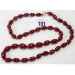 Cherry amber oval graduated bead necklace with gold clasp, weight 23.8g approx.
