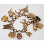 9ct gold charm bracelet with a mixture of 9ct, silver gilt and metal charms including a 9ct