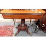 Regency mahogany tea table, the hinged moulded top with curved corners over a baluster turned