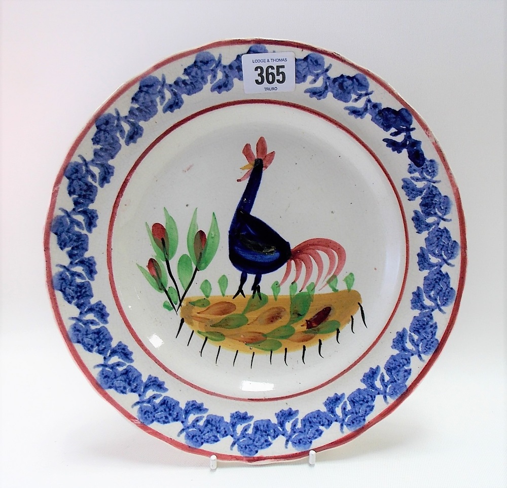 An early 20th Century Welsh cockerel painted plate, polychrome painted & with sponge decorated