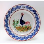 An early 20th Century Welsh cockerel painted plate, polychrome painted & with sponge decorated