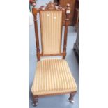 Victorian walnut framed upholstered nursing chair; together with one other nursing chair