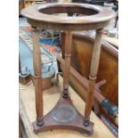 19th Century mahogany circular two-tier wash stand with three turned supports united by a triform