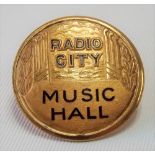 Rare early 20th Century American Art Deco gilt metal & enamel mount or badge for 'RADIO CITY MUSIC