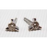 Pair of 18ct white gold diamond set earrings, the diamonds of 0.05ct spread approx.