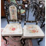 A pair of Victorian black mother of pearl inlaid & gilt painted papier mache chairs with upholstered