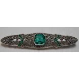 Art Deco white metal paste & emerald set brooch, the untested emerald of 2ct spread approx, width