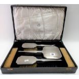 Art Deco George V silver engine turned six piece dressing table set comprising two hairbrushes, hand