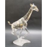 Swarovski crystal model of a giraffe, with gilt lustre spots, height 17cm.