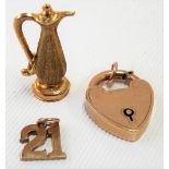 A gold padlock together with two 9ct gold charms, weight 5g approx.