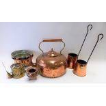 Seven copper and brass items, to include two jelly moulds, a large copper and brass kettle, two