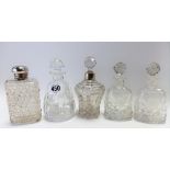 Five cut glass scent bottles, one with silver collar, Birmingham 1904.