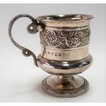 Good George IV silver pedestal cup, embossed and engraved with a foliate scroll band and with