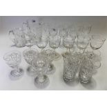 A collection of cut drinking glasses, two cut glass jugs & a set of six wheel engraved wine glasses