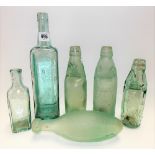 Six various early 20th Century advertising glass bottles, including a Hicks St Austell beer bottle.