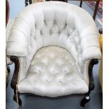 Victorian buttonback upholstered tub chair with leaf scroll arms & cabriole legs with castors