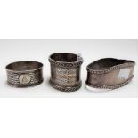 Three hallmarked silver napkin rings, weight 2.75oz approx.