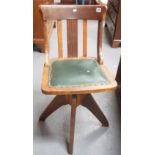 Early 20th Century oak swivel office chair with green Rexene upholstered seat