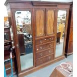 Edwardian triple robe, the break front moulded cornice over a central cupboard & four drawers