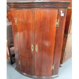 George III mahogany bow front wall hanging corner cupboard