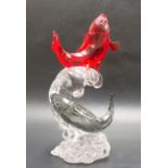 Swarovski red grey and clear crystal model of two leaping carp fish, height 16cm.