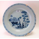 18th Century Delft blue & white dish, decorated with flowers & trees, the rim with geometric band,