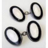Pair of silver black and white guilloche enamel oval cufflinks.