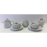 Continental porcelain dolls tea set for two, each piece encrusted with forget-me-nots and polychrome