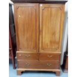 19th Century mahogany linen press, the moulded dentil cornice over two cupboard doors enclosing four