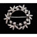 18ct white gold & diamond floral openwork circular brooch, with twelve diamonds of 0.04ct spread